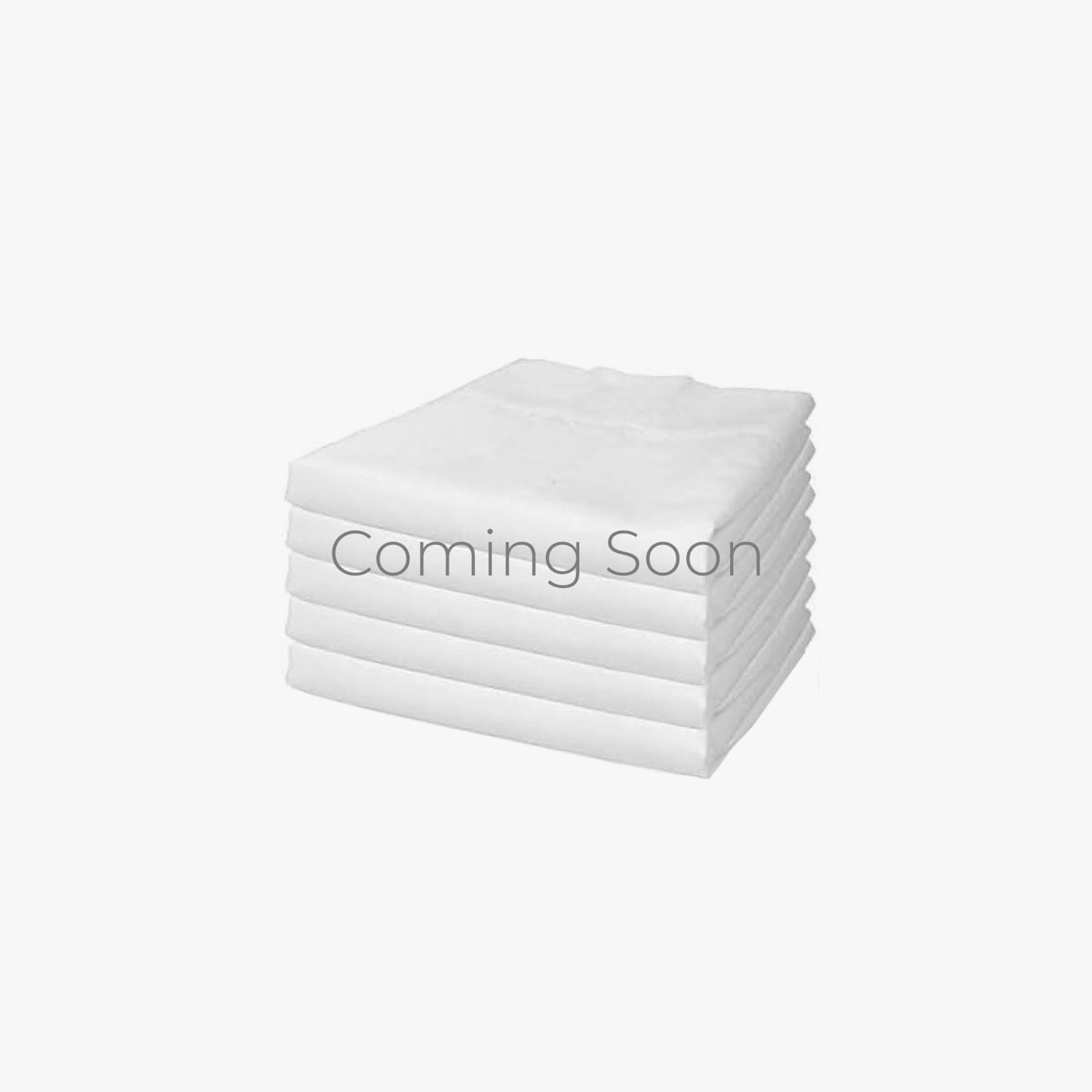 The Drop Pillow with a folded set of spare covers